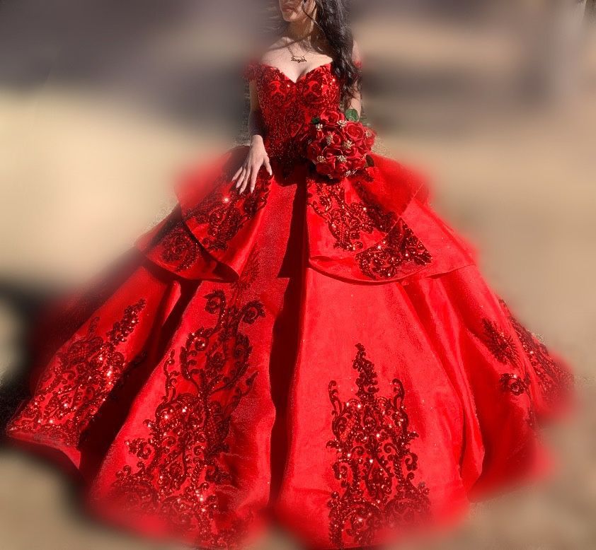 A red off-shoulder sparkly tulle quinceanera ball gown & red crystal tiara