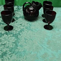vintage ruby red glass pitcher with six glasses