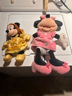 Two Minnie Mouse plush dolls