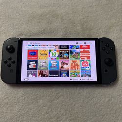 NINTENDO SWITCH OLED + 125 SWITCH GAMES 