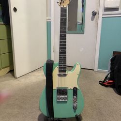 Sawtooth 6-string Electric guitar; includes guitar, strap, stand and guitar case.