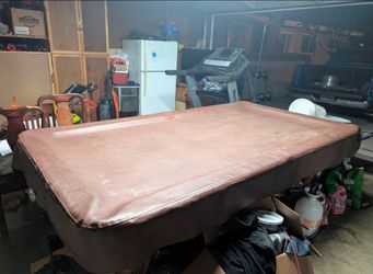 Pool Table With Red Felt, Balls, Cues, And Cover