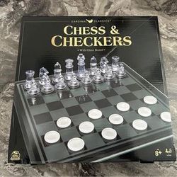 new sealed chess and checkers set with glass board