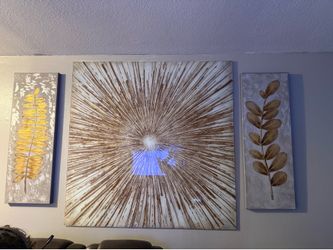 For sale glass sunburst and 2 canvas