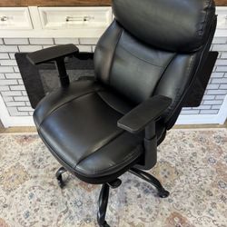 Black Mid back executive office chair with Rollerblade wheels