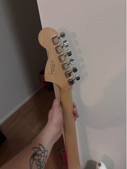 Fender Squire guitar and Peavey Amp