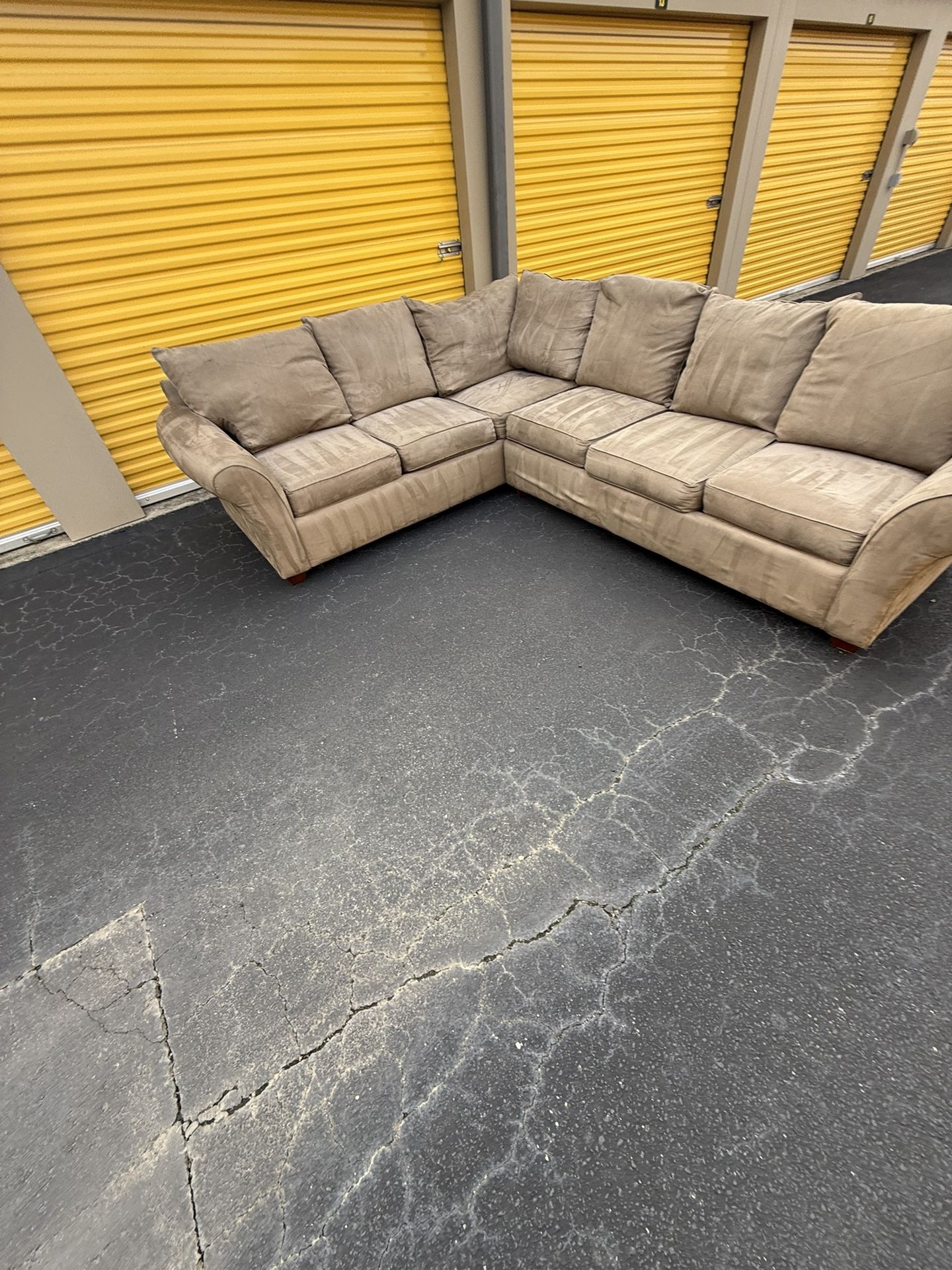 Tan 2pc sectional set W/ Coffee And 2 End Tables. $500. Will deliver for a fee.