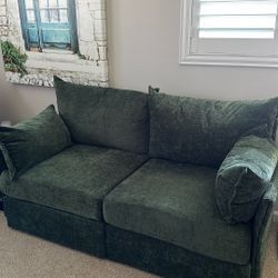 Dark green loveseat