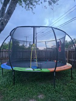 14' trampoline no damage no rips. $250 you need to disassemble and pick up