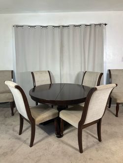 Ashley Furniture Extendable Dining Table with 6 Upholstered Chairs