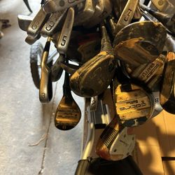 Golf Bag , Carrier And Many Different Size Of Sticks And A Few Balls All For Sale 