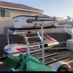1993 Double trailer and two Sea-doo jet skis and a water pack boat