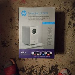  HP  PROJECTOR  CC 200   84-IN SCREEN INCLUDED WITH ROKU  EXPRESS