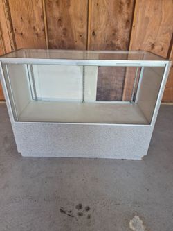 Glass counter with sliding doors and lights