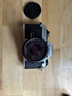 Nikon FG-20 with 50 mm pancake lens and case (and bonus Tokina tele)