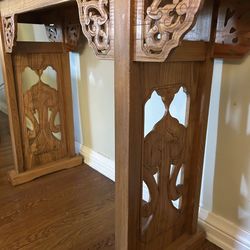 Carved wood entry table