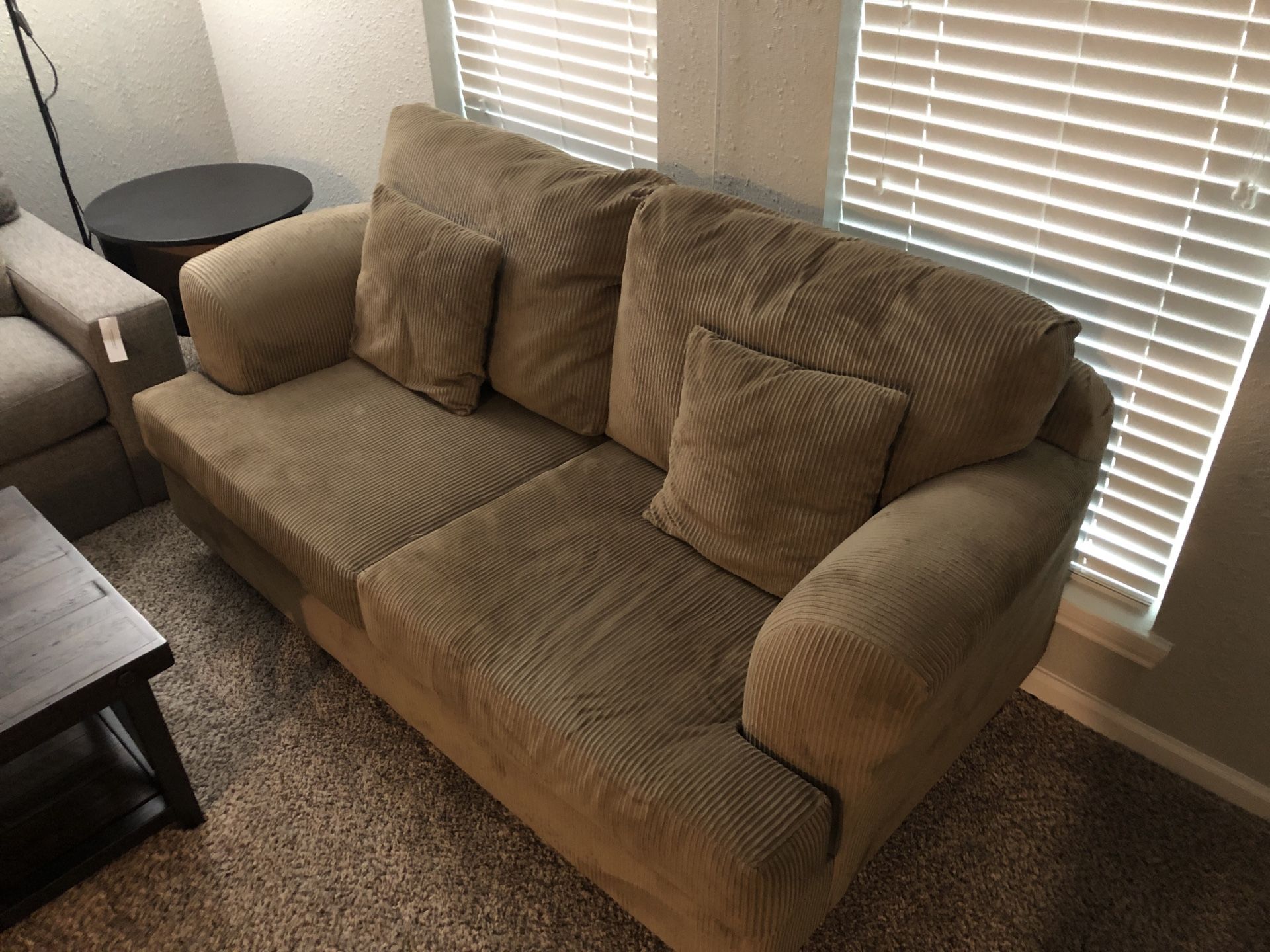 Oversized Love Couch and a Sony 52” HDTV 1080P