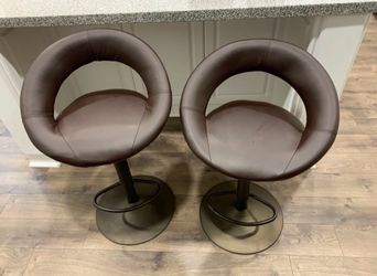 2 Faux Leather Swivel Chairs