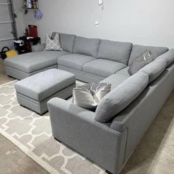 Sectional Sofa With Rug And Storage Ottoman. Free Delivery Available 
