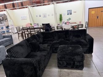 Gorgeous! Sectional sofa with ottoman black fur- like jumbo corduroy