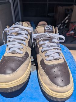 These shoes are the highly sought-after 2005 Nike Air Force 1 Low "Brown Pride" (Style Code: 307334-221)