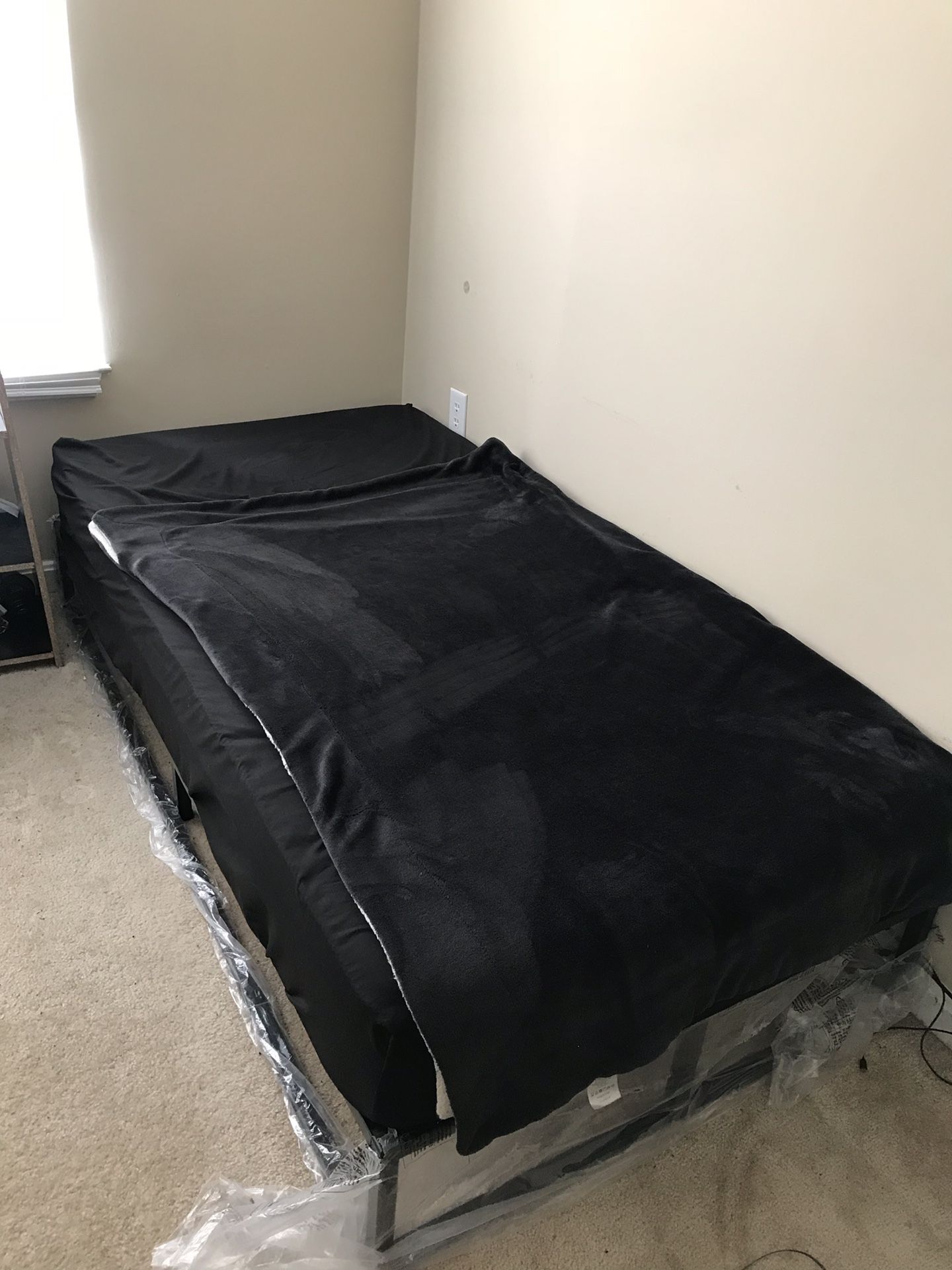 Twin Bed and Mattress, L Shaped desk, small and long pillows and carpet.