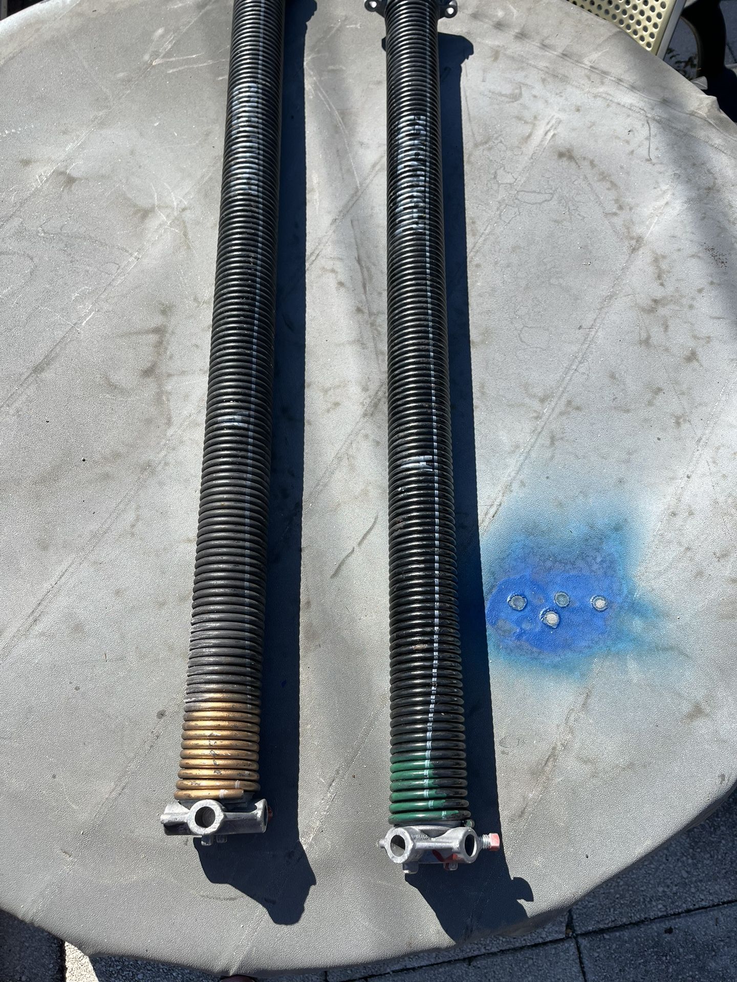 Double garage door springs in good condition, each spring measures 34 1/2 inches.