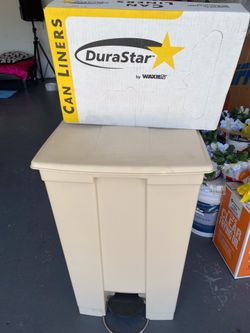 Large Rubbermaid trash bin (includes case of trash bags)