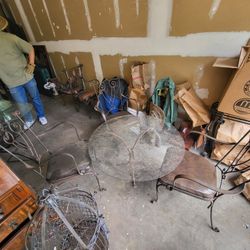 Is small glass table right iron chairs