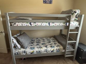 Bookshelf and twin size bunk bed with mattresses