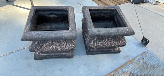 Two small resin urns