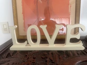 Antique-style white wooden "LOVE" sign