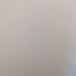 Beige lateral file cabinet.