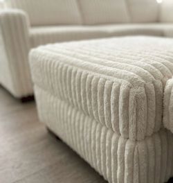 Brand new milk color fur like corduroy Sectional Sofa with ottoman and 2 accent pillows.