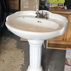 Pedestal Sink And Bathroom Wall Cabinet 