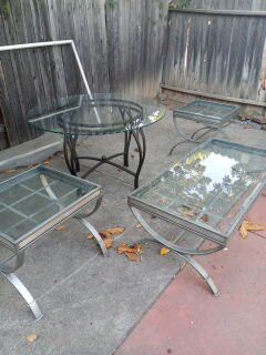 Glass Dinning room table with 4 chairs, Glass Coffee table with 2 matching end tables.