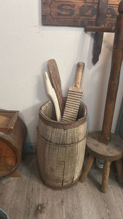 Antique barrel with wooden washboard and washing bats