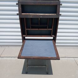 Antique wall hanging desk with chalkboard.