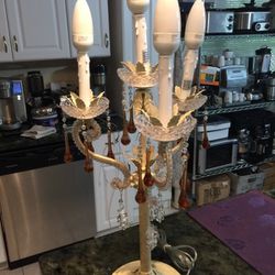 Vintage upright chandelier with four candelabra lights and hanging color glass crystals. 25" tall