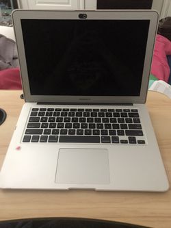 Apple MacBook Air, in good condition comes with charger and charger extender