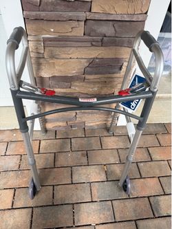 a Drive Medical Deluxe Two Button Folding Walker