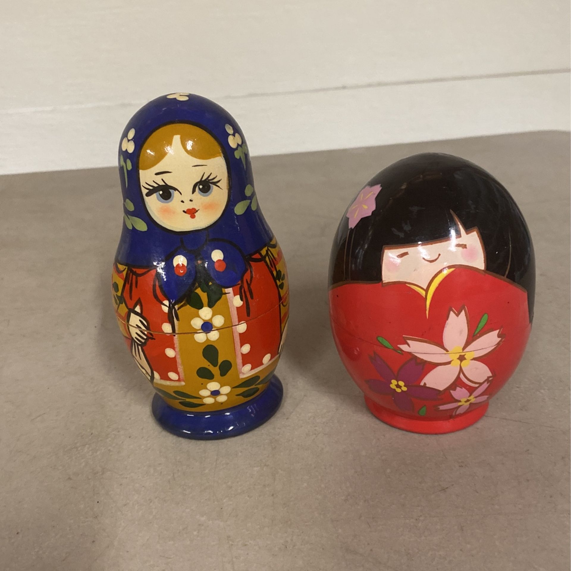 Russian Nesting Dolls And Japanese Kokeshi Nesting Dolls