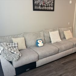 Modern 4-Seater Sectional Sofa – Light Gray with Plush Corduroy Back Cushions