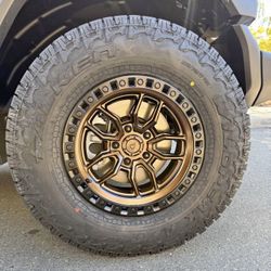 Arena Hustle Smoked Bronze Satin Black Lip Wheels 285|70R17 Falken Wildpeak AT4W Tires Package Deal