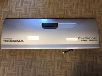 Silver 2008-2013 Tacoma tailgate with harness and camera in great condition