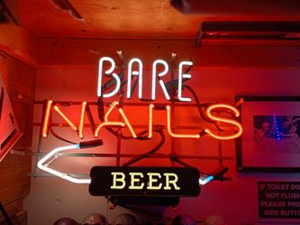 Bare nails glass tube neon sign