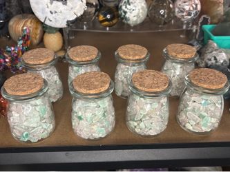 3.4 oz glass jars filled with clear quartz, rose quartz and green aventurine chips $20/each