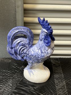 vintage ceramic or porcelain rooster figurine, likely hand-painted in a blue and white faience or majolica style.