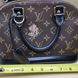 Authentic Louis Vuitton My LV World Tour Alma BB handbag Entrupy Certified. 