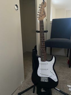 Squier Mini Stratocaster and a fender champion 20 speaker